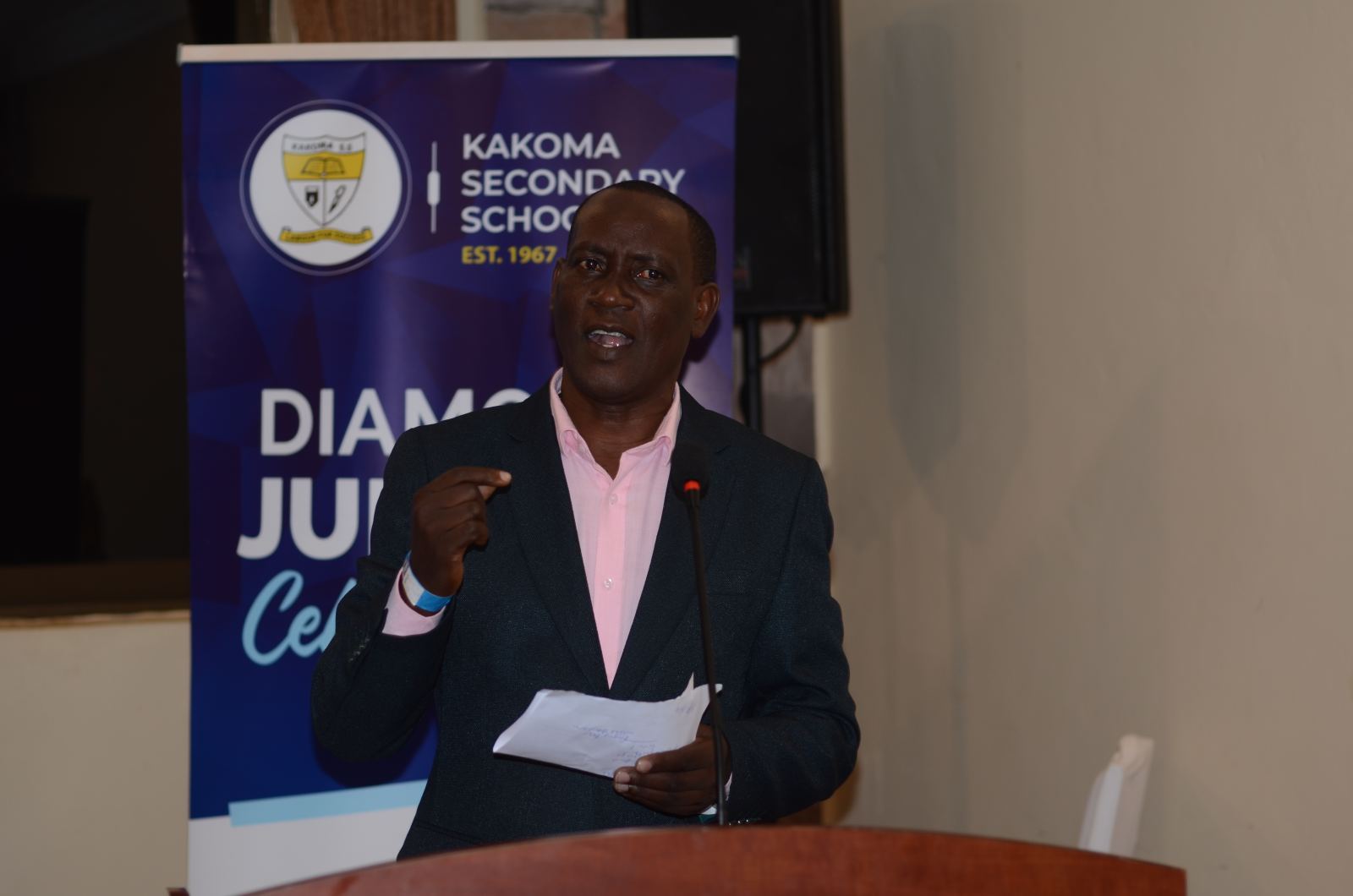 Head Teacher Bbale David speaking at the Diamond Jubilee celebration