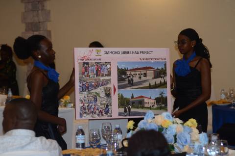 Old students unveil the Diamond Jubilee Hall Project board, showing the journey from where the school is to where it wants to be.